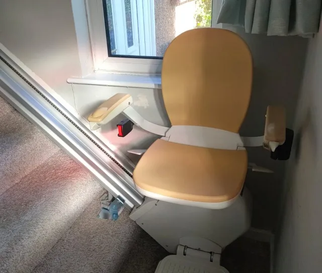 Tan seat on a straight stairlift