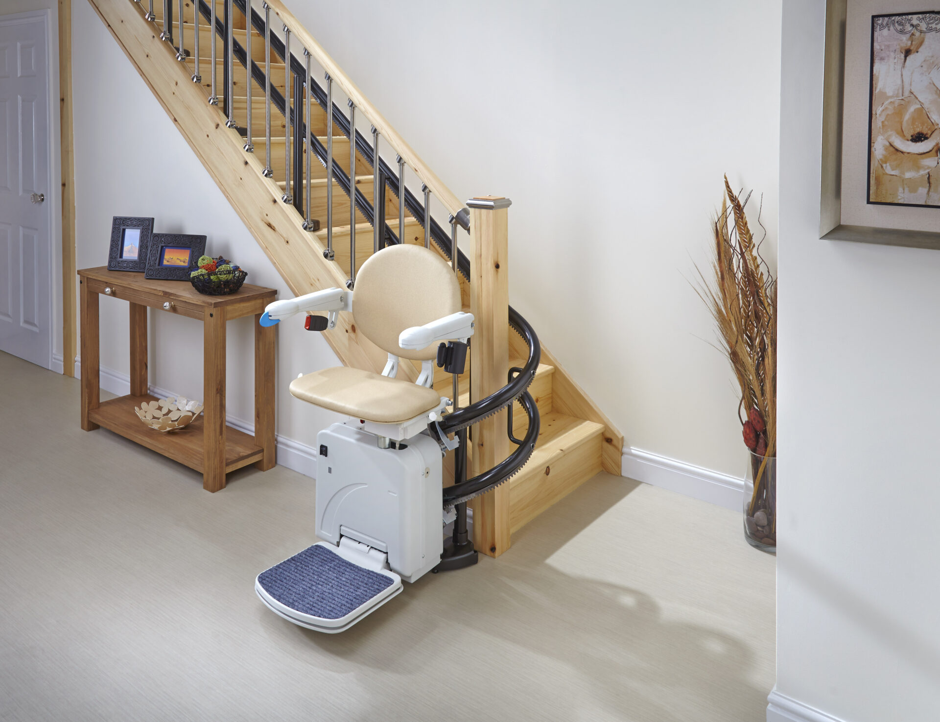 Curved Stairlift with ample wheelchair space in a clean, modern home.