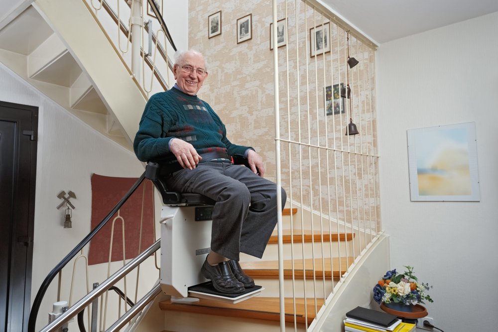 Elderly,Man,In,The,Staircase,Using,The,Stairlift